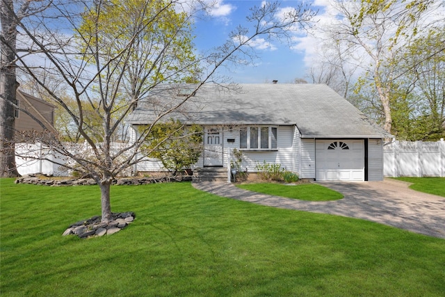 single story home with a garage, aphalt driveway, fence, and a front yard