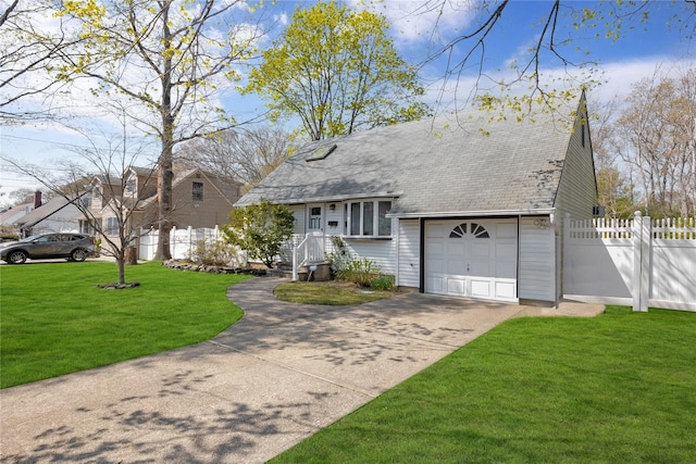 view of front of house featuring roof with shingles, a front yard, a garage, fence, and concrete driveway