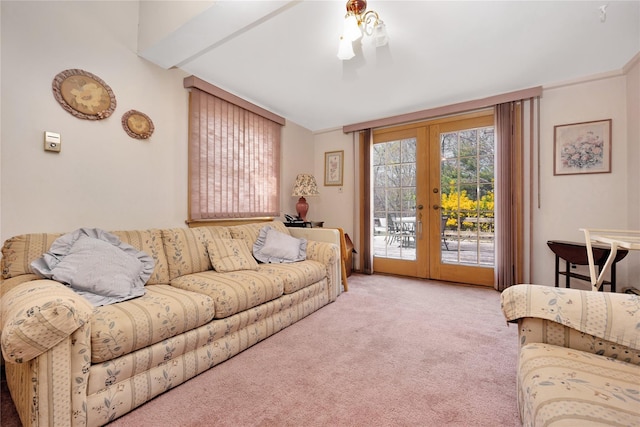 carpeted living area with french doors