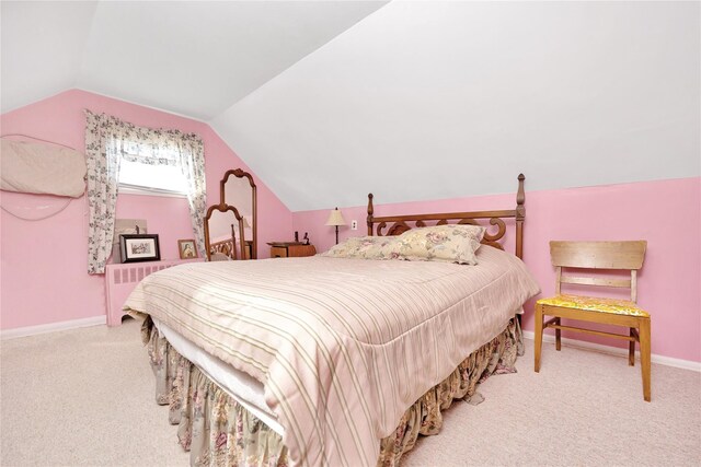 bedroom featuring baseboards, vaulted ceiling, radiator heating unit, and carpet
