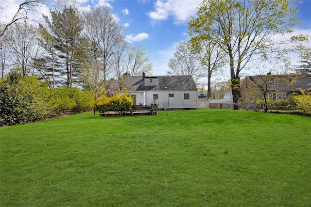 view of yard with a wooden deck