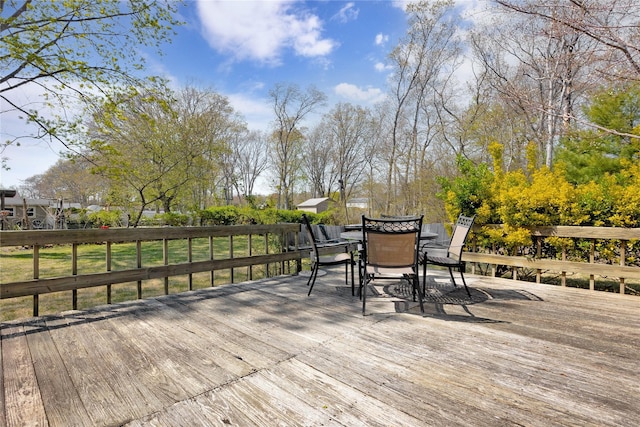 deck with outdoor dining space