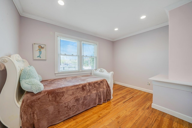 bedroom with ornamental molding, baseboards, recessed lighting, and light wood-style floors
