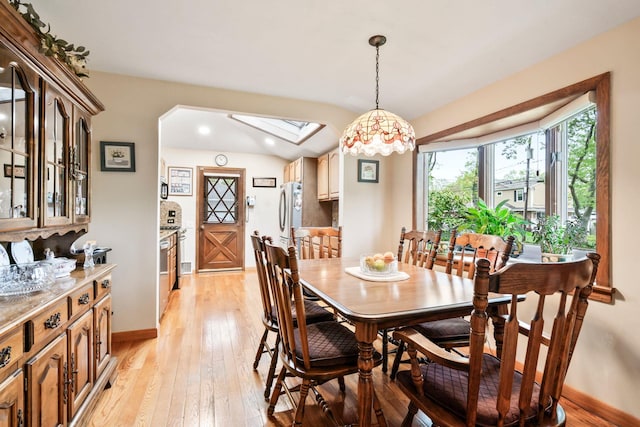 15 Kevin Rd, Commack, NY 11725 - dining area featuring light wood-type flooring, a skylight, and baseboards