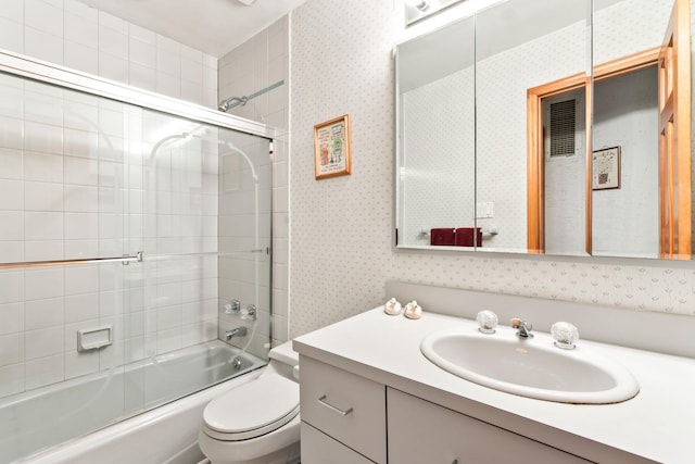 15 Kevin Rd, Commack, NY 11725 - full bath with vanity, toilet, enclosed tub / shower combo, and wallpapered walls