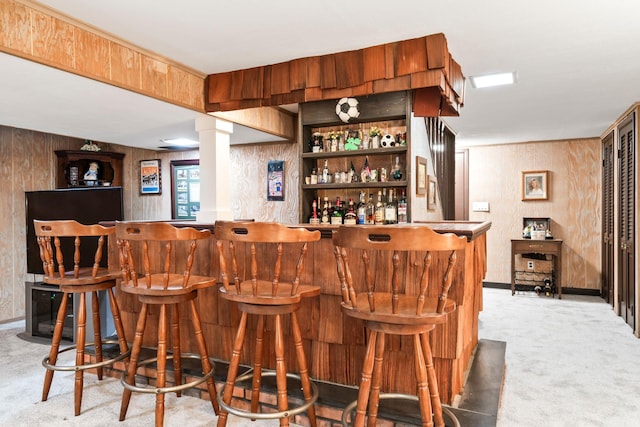 15 Kevin Rd, Commack, NY 11725 - indoor dry bar featuring light carpet, baseboards, and wooden walls