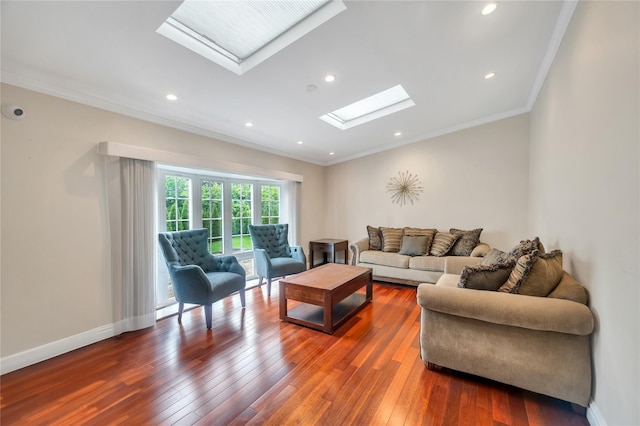 living room featuring a skylight, ornamental molding, hardwood / wood-style flooring, recessed lighting, and baseboards