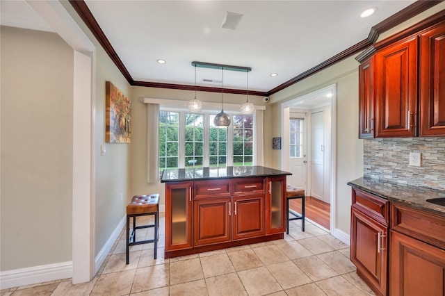 kitchen with backsplash, baseboards, ornamental molding, decorative light fixtures, and dark brown cabinets