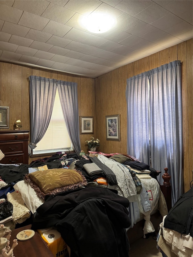 1171 Leland Ave, Bronx, NY 10472 - bedroom featuring wooden walls and multiple windows
