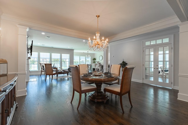 dining area featuring an inviting chandelier, crown molding, french doors, and dark wood-style floors