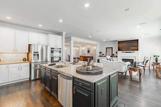 kitchen featuring crown molding, white cabinets, stainless steel appliances, and dark wood-style flooring