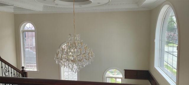 room details with an inviting chandelier and crown molding