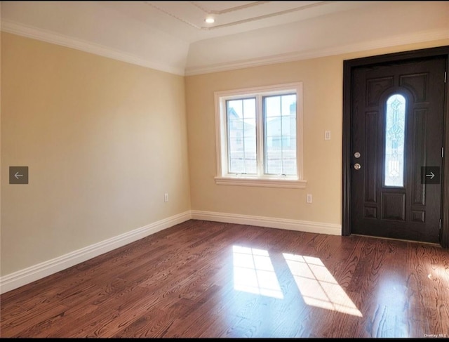 entrance foyer with baseboards, ornamental molding, and wood finished floors