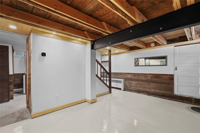 16 Nelson Ln, Garrison, NY 10524 - finished below grade area featuring radiator heating unit, wooden walls, wooden ceiling, and stairway