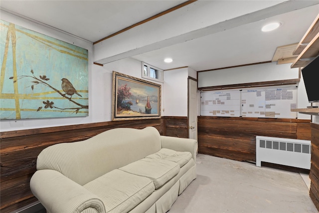 16 Nelson Ln, Garrison, NY 10524 - living area with radiator heating unit, wainscoting, concrete flooring, and recessed lighting