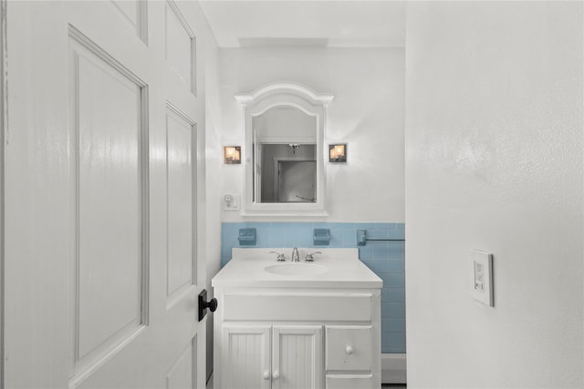 16 Nelson Ln, Garrison, NY 10524 - bathroom with tile walls, wainscoting, and vanity