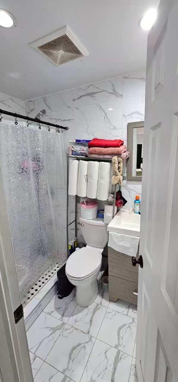 full bathroom with visible vents, marble finish floor, a stall shower, and vanity