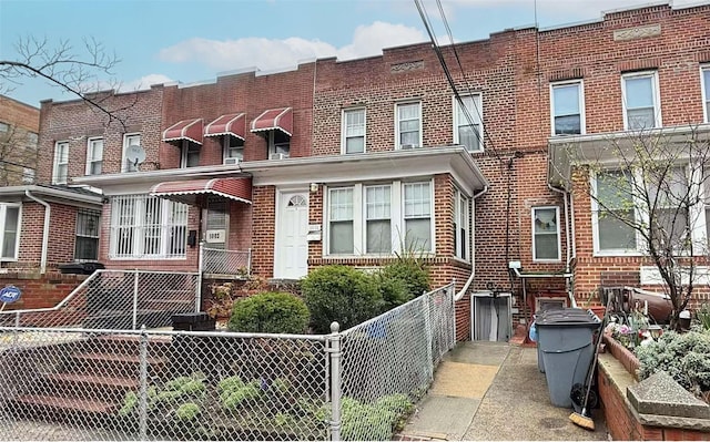 50-05 46th St, Woodside, NY 11377 - view of property with brick siding and fence