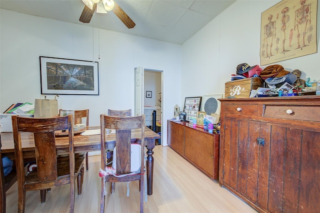 dining area featuring light wood-type flooring and ceiling fan