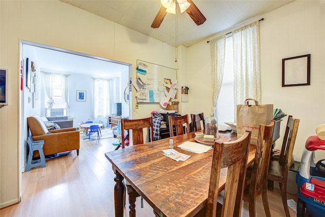 dining room featuring ceiling fan and wood finished floors