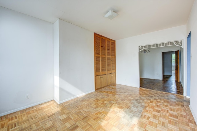 empty room featuring baseboards