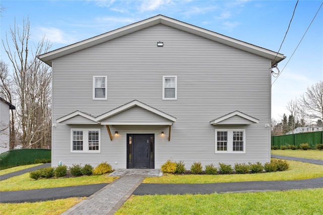 93 Wood Ave, Monticello, NY 12701 - view of front of house featuring a front lawn and fence