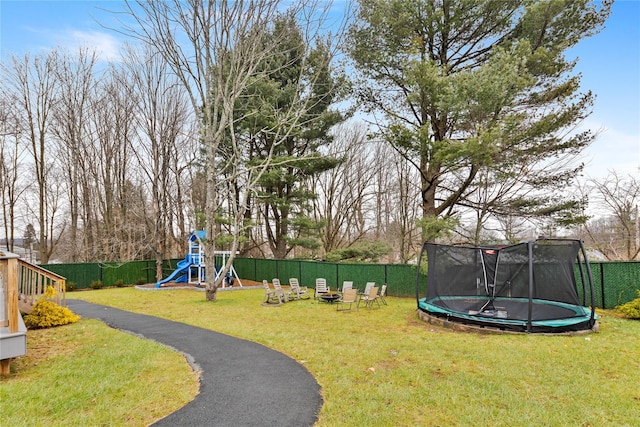 93 Wood Ave, Monticello, NY 12701 - exterior space featuring a lawn, a trampoline, and fence private yard