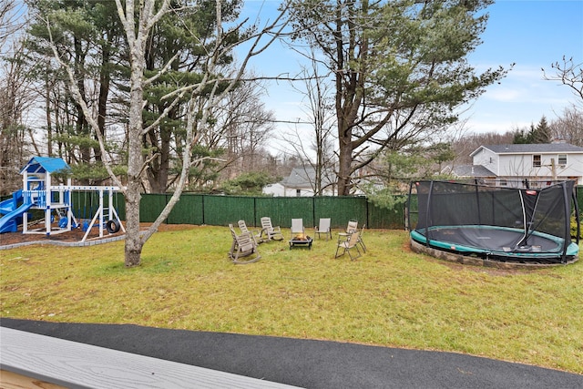 93 Wood Ave, Monticello, NY 12701 - view of yard featuring a fenced backyard, a trampoline, and a playground