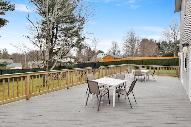93 Wood Ave, Monticello, NY 12701 - wooden deck featuring outdoor dining area and a fenced backyard