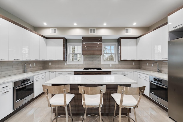 93 Wood Ave, Monticello, NY 12701 - kitchen featuring stainless steel appliances, visible vents, and a sink
