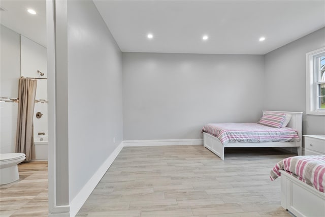 93 Wood Ave, Monticello, NY 12701 - bedroom featuring recessed lighting, light wood-style flooring, ensuite bath, and baseboards