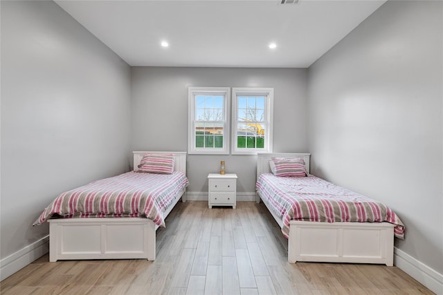 93 Wood Ave, Monticello, NY 12701 - bedroom featuring recessed lighting, baseboards, and wood finished floors