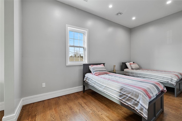 93 Wood Ave, Monticello, NY 12701 - bedroom featuring baseboards, recessed lighting, wood finished floors, and visible vents