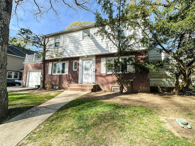 329 E Euclid St, Valley Stream, NY 11580 - view of front of property with brick siding, a garage, a balcony, and a front yard