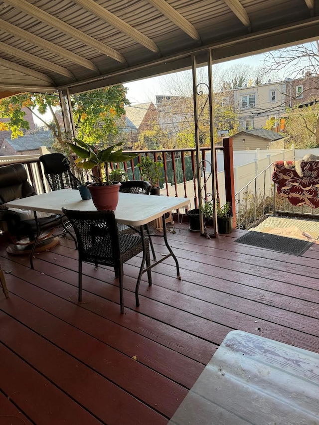 wooden terrace with outdoor dining area