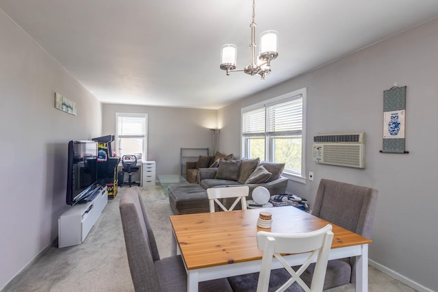 dining space featuring baseboards, an inviting chandelier, light carpet, and a wall unit AC