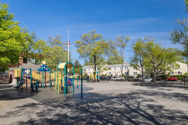communal playground featuring fence