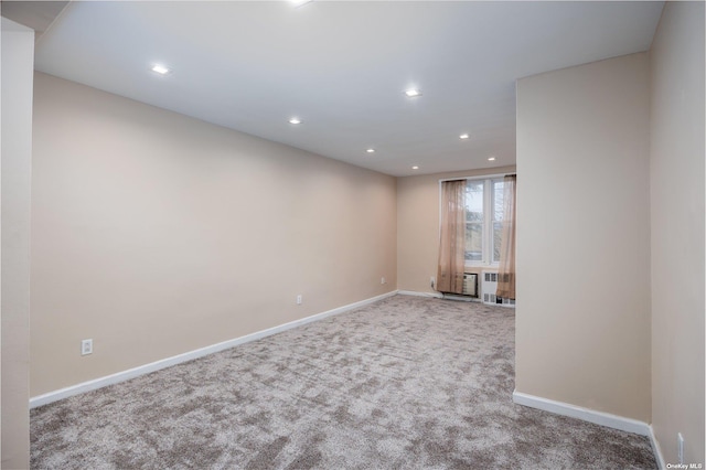 carpeted spare room with baseboards and recessed lighting