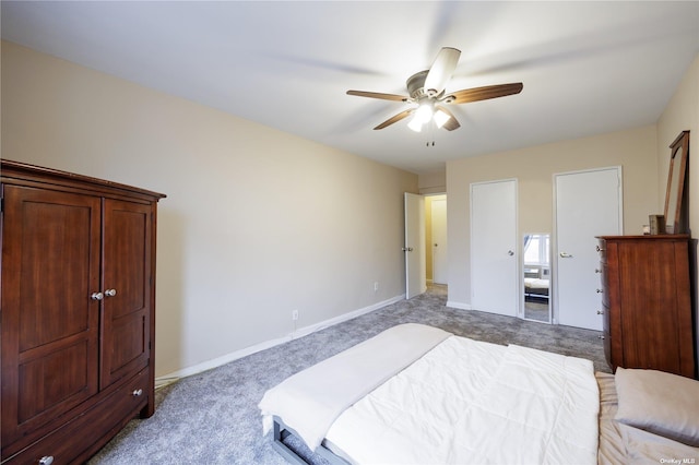 bedroom with baseboards, ceiling fan, and light carpet