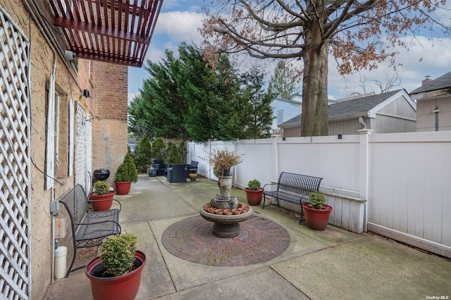 view of patio featuring a fenced backyard and a pergola