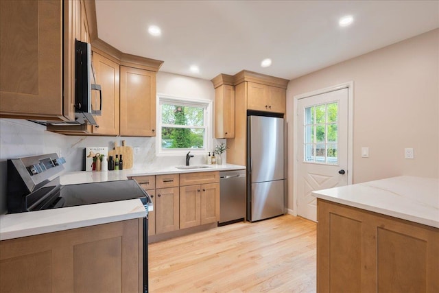 105 Phyllis Dr, Lindenhurst, NY 11757 - kitchen featuring a sink, stainless steel appliances, light brown cabinets, light wood-type flooring, and recessed lighting