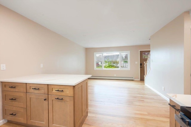105 Phyllis Dr, Lindenhurst, NY 11757 - kitchen featuring a baseboard heating unit, light wood-type flooring, light stone countertops, baseboards, and open floor plan
