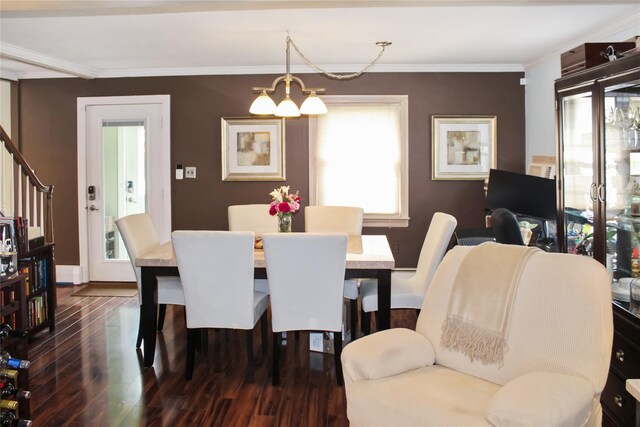 dining room with crown molding, baseboards, dark wood-style floors, a notable chandelier, and stairs