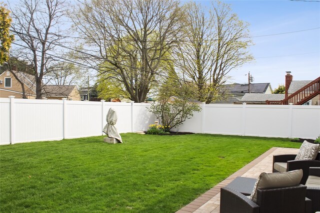 view of yard with a fenced backyard