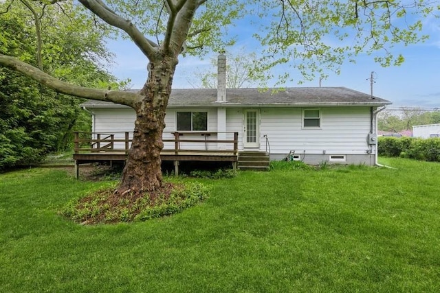 900 Cedar Dr, Southold, NY 11971 - rear view of house featuring a deck, a lawn, and a chimney
