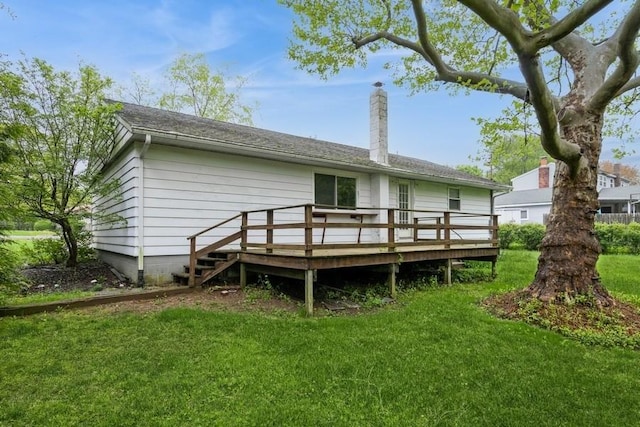 900 Cedar Dr, Southold, NY 11971 - back of house featuring a deck, a lawn, and a chimney