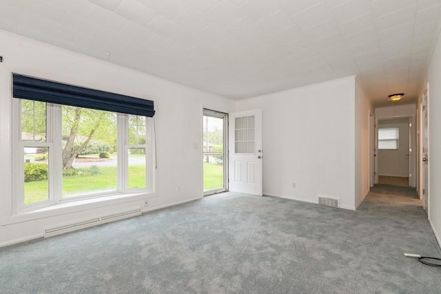 900 Cedar Dr, Southold, NY 11971 - carpeted empty room featuring a baseboard radiator, healthy amount of natural light, and baseboards
