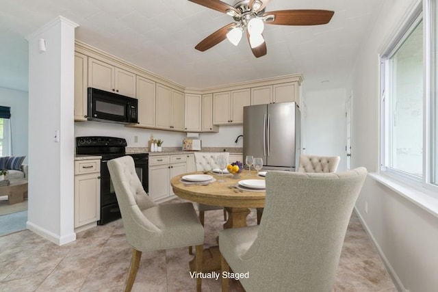900 Cedar Dr, Southold, NY 11971 - kitchen featuring black appliances, cream cabinetry, light countertops, and ceiling fan