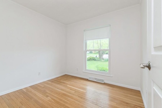 900 Cedar Dr, Southold, NY 11971 - spare room with light wood-style floors, crown molding, and baseboards
