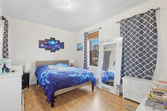 bedroom featuring light wood finished floors